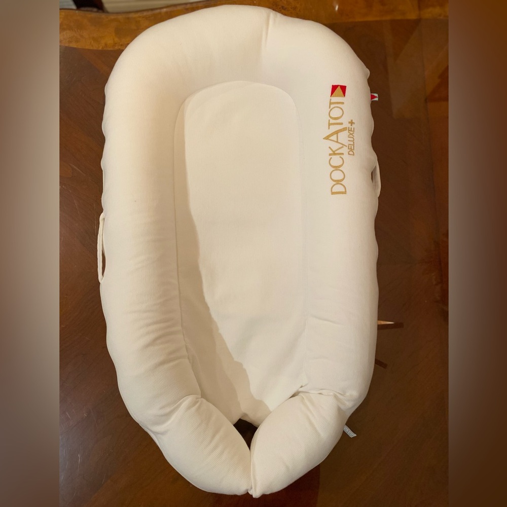 Dockatot deluxe in Pristine White. Used Gently.